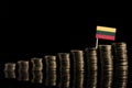 Lithuanian flag with lot of coins isolated on black