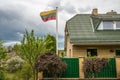 Lithuanian flag near brick house