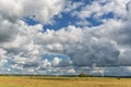 Lithuanian Landscape and Nature with Windmill and Cloudy Blue Sky in Background