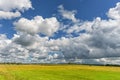 Lithuanian Landscape and Nature with Windmill and Cloudy Blue Sky in Background