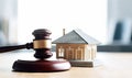 Litigating Mortgages Judge\'s Gavel and Miniature House in Legal Scene - Generative AI