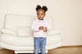 Litle cute sweet african-american girl playing happy with toys at home, lifestyle children concept