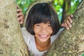 Litle girl smile happy on tree