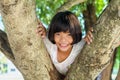 Litle girl smile happy on tree