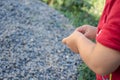 A litlle child playing with stones on the mountain with stones