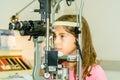 Litlle girl taking the eye exam test Royalty Free Stock Photo