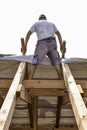 Litovel, Czech Republic August 3th 2018, top view on a carpenter standing on a roof timber construction of a clay house