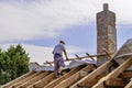 Litovel, Czech Republic August 3th 2018, top view on a carpenter standing on a roof timber construction of a clay house Royalty Free Stock Photo