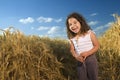 Littel girl in a wheat field Royalty Free Stock Photo