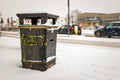 Litter bin in winter snow in town in england uk during covid lockdown Royalty Free Stock Photo