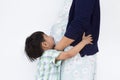 The litter boy is hugging and kissing his pregnant mother. Royalty Free Stock Photo