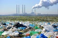 Littered landscape with industrial smokestacks