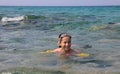 Littl girl swiming on the sea Royalty Free Stock Photo