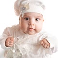 Little 3 months baby-girl dressed in white suit