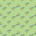 Little abstract blue and brown colored yarrow ornament seamless pattern on light green background.