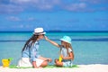 Little adorable girl applying sun cream to her Royalty Free Stock Photo