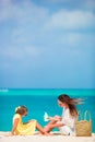 Little adorable girl applying sun cream to her mother nose Royalty Free Stock Photo