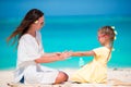 Little adorable girl applying sun cream to her mother nose Royalty Free Stock Photo