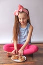 Little adorable girl with donuts. Royalty Free Stock Photo