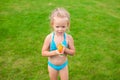 Little adorable girl playing with water gun Royalty Free Stock Photo