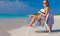 Little adorable girls in beach chair during Royalty Free Stock Photo