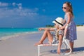 Little adorable girls in beach chair during Royalty Free Stock Photo