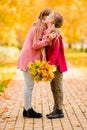 Little adorable girls at warm day in autumn park outdoors Royalty Free Stock Photo