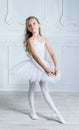 A little adorable young ballerina in a playful mood in the inter Royalty Free Stock Photo