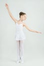 A little adorable young ballerina poses on camera Royalty Free Stock Photo