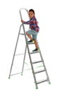 Little African-American boy climbing up ladder on background. Danger at home Royalty Free Stock Photo