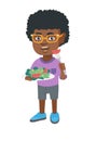 Little african-american boy eating vegetable salad Royalty Free Stock Photo