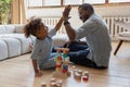 Little african american boy giving high five to smiling daddy. Royalty Free Stock Photo