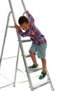 Little African-American boy  up ladder on white background. Danger at home Royalty Free Stock Photo