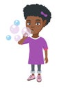 Little african-american girl blowing soap bubbles. Royalty Free Stock Photo