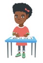 Little african-american girl playing the piano. Royalty Free Stock Photo