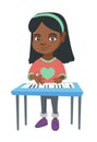 Little african-american girl playing the piano. Royalty Free Stock Photo