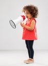 Little african american girl shouting to megaphone Royalty Free Stock Photo