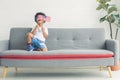 A little african black boy is waving american flag in living room Royalty Free Stock Photo