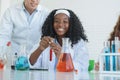 Little African black kids learning chemistry in school laboratory Royalty Free Stock Photo
