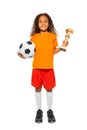 Little African girl holding soccer ball and prize Royalty Free Stock Photo