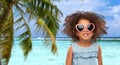 Little african girl in sunglasses on beach Royalty Free Stock Photo