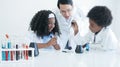 Little African kids studying chemistry and doing chemical science experiment in laboratory at school Royalty Free Stock Photo