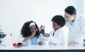 Little African kids studying chemistry and doing chemical science experiment in laboratory at school. Royalty Free Stock Photo