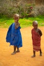 Little African Maasai children look friendly at the camera