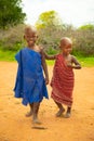 Little African Maasai children look friendly at the camera