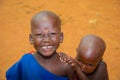 Little African Maasai children look friendly at the camera