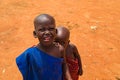 Little African Maasai children look friendly at the camera