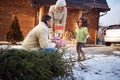 Little afro American girl parents give Christmas presents