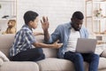 Little Afro Son Asking Attention From His Father Busy With Laptop