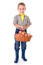 Little agriculturist holding onions